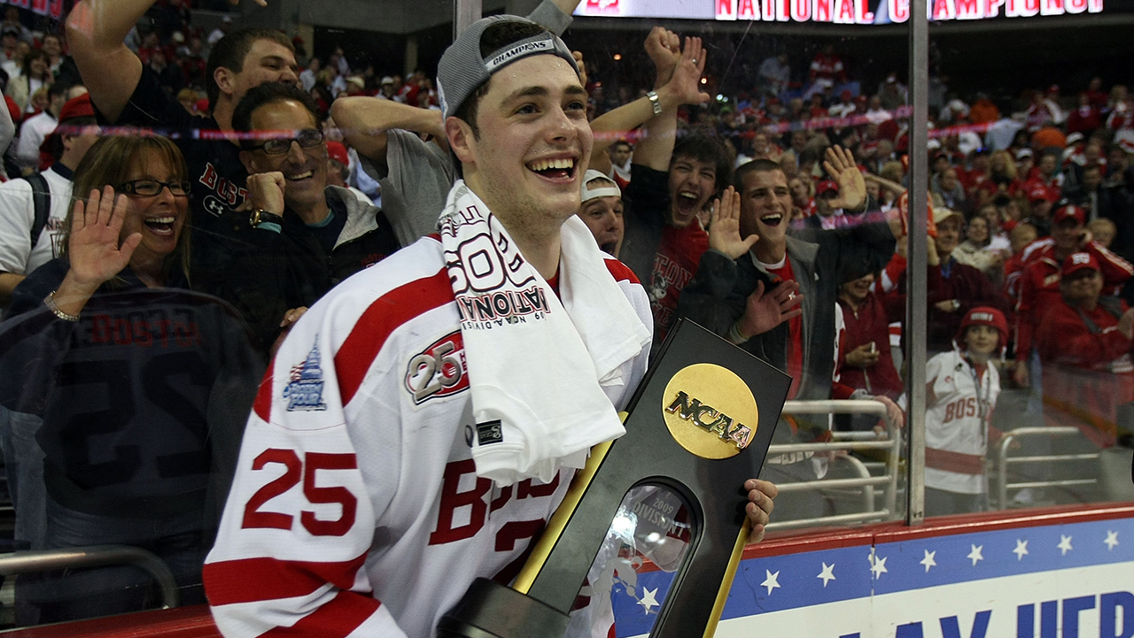 WASHINGTON - APRIL 11:  Colby Cohen #25 of the Boston Terriers celebrates with the championship trophy after defeating the Miami Red Hawks during the NCAA Men's Frozen Four Championship game on April 11, 2009 at the Verizon Center in Washington, DC. Boston defeated Miami 4-3 in overtime to win the national title.  (Photo by Elsa/Getty Images)